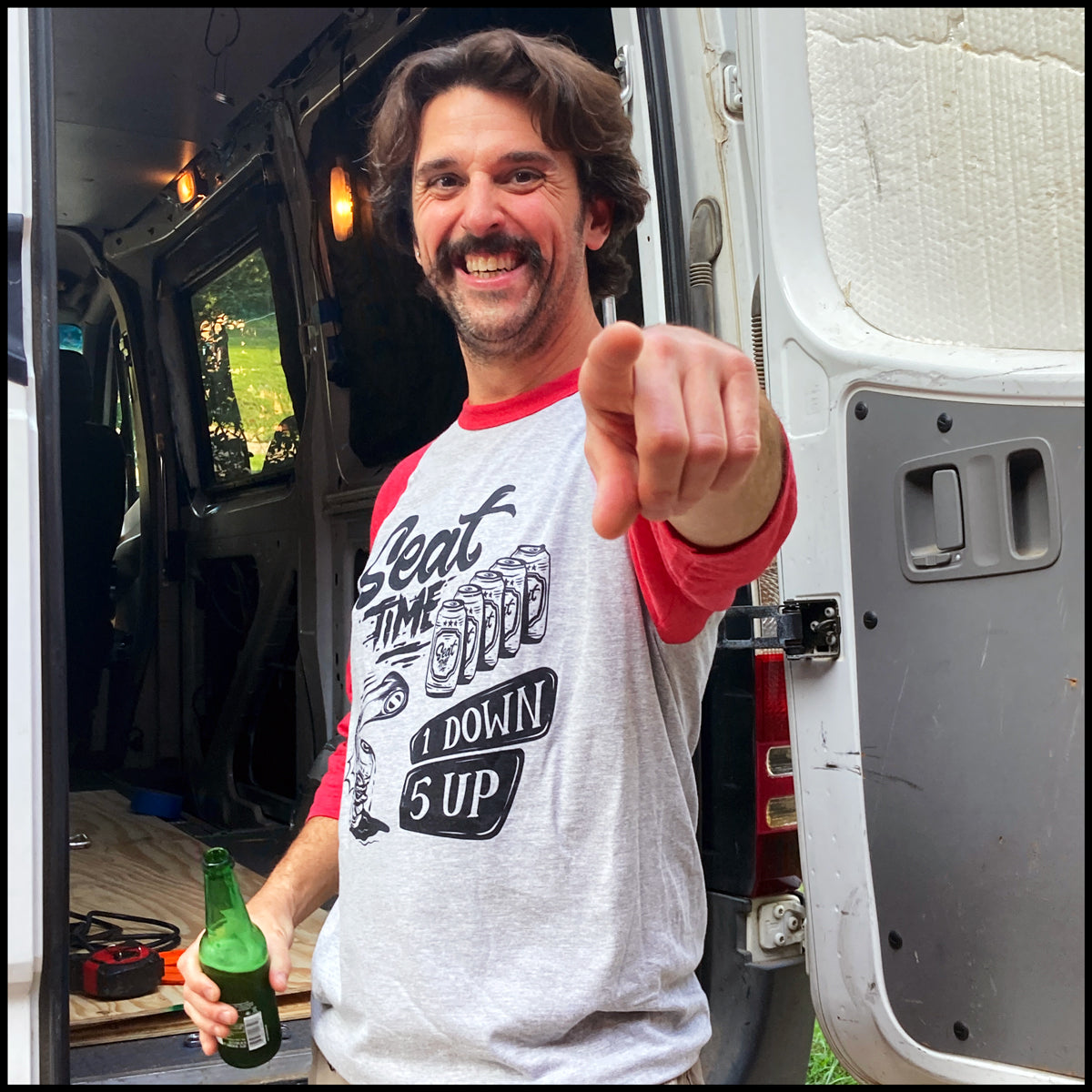 Lifestyle shot of Brian Pierce, the Purveyor of Awesome himself, showing off the One Down Five Up Raglan Shirt